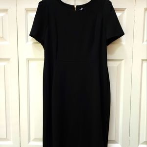 Calvin Klein black dress, short-sleeved, gold back zipper.